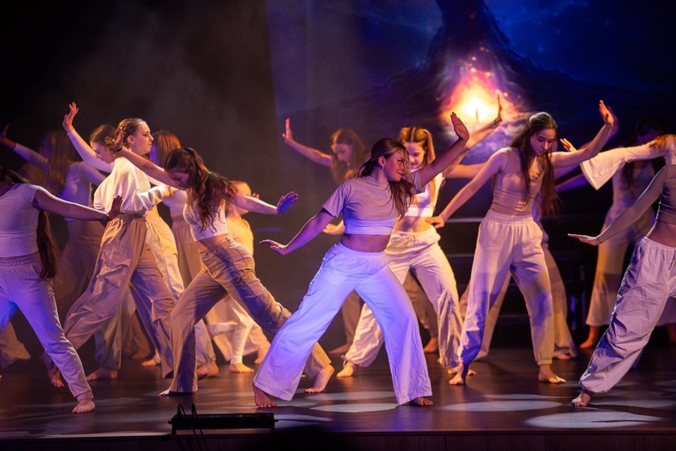 Dancers from Arcoballeno ZUŠ Strážnice performing on stage.